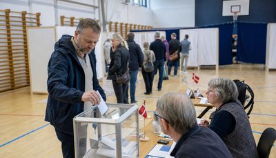 Voter casting a ballot at a Danish polling station