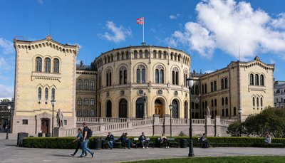 Norwegian parliament building with flag